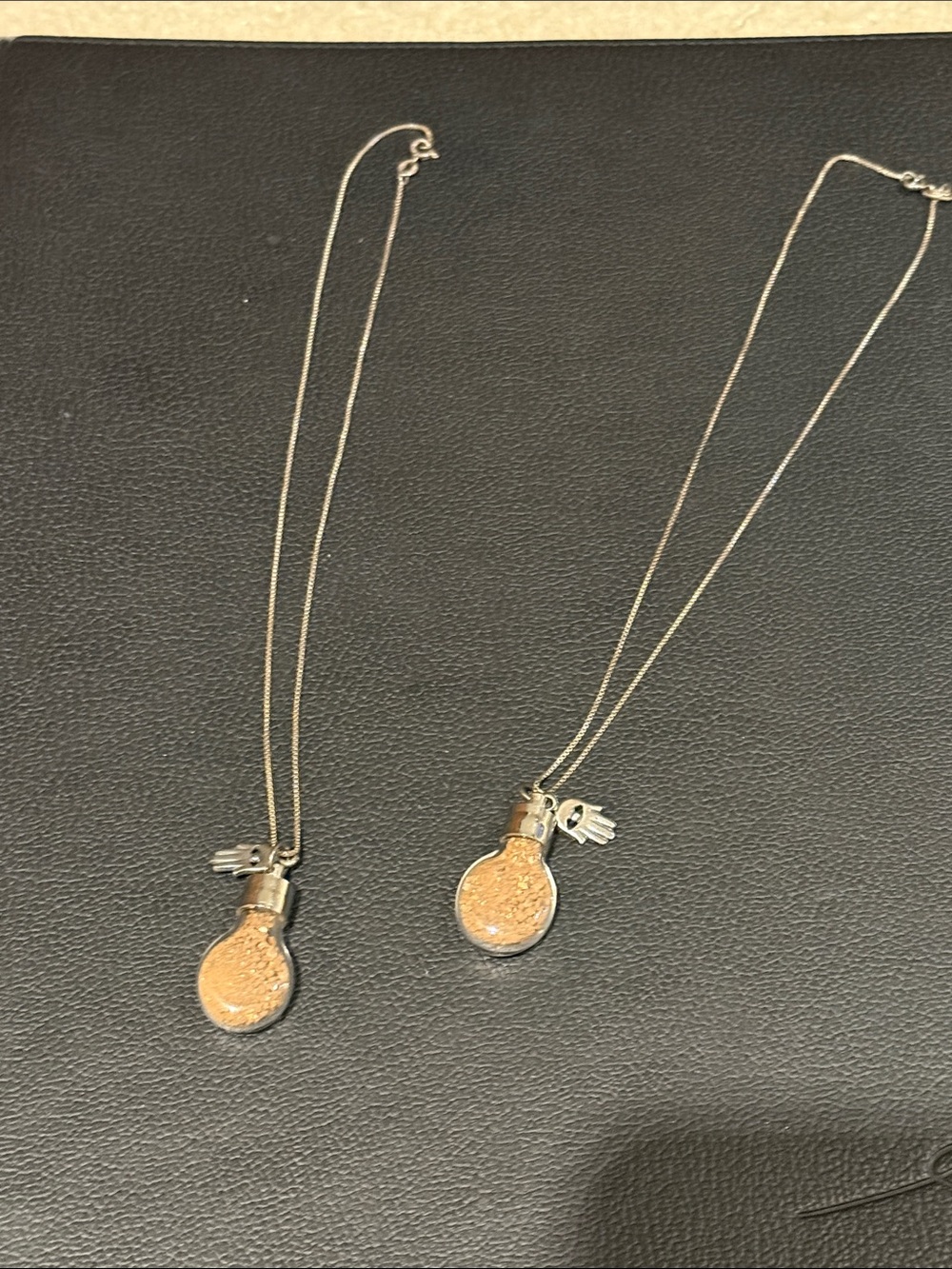 Sterling silver hamsa necklace with vial of dirt from holy land